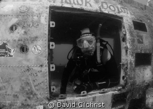 Diver poses inside Blackhawk Helicopter by David Gilchrist 